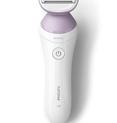 Aqui estão algumas opções de texto ALT para a imagem, com diferentes níveis de detalhe e foco: **Opção 1 (Simples e direta):** `Lady Shaver Philips Series 6000` **Opção 2 (Um pouco mais descritiva):** `Lady Shaver Philips para depilação suave e eficiente` **Opção 3 (Foco no modelo):** `Lady Shaver Philips BRL136/00, da Series 6000` **Opção 4 (Considerando acessibilidade):** `Imagem de um Lady Shaver Philips da Series 6000, modelo BRL136/00, para depilação feminina.` **Recomendação:** A opção mais recomendada, considerando o contexto (dados do produto) e acessibilidade, é a **Opção 3: `Lady Shaver Philips BRL136/00, da Series 6000`**. Ela identifica claramente o produto e o modelo.